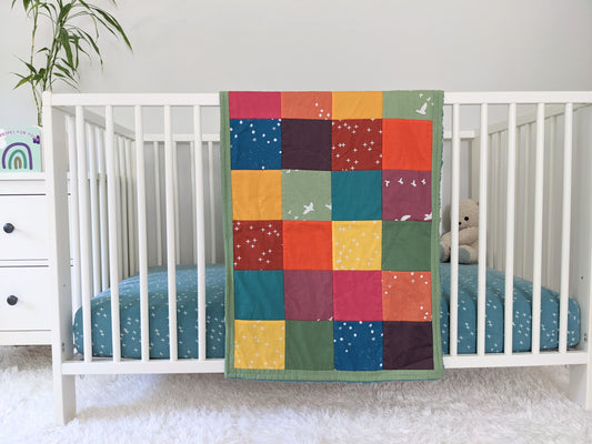 Baby Peipei 's organic patchwork quilts with bright colors. This patchwork quilt is security blankie size. With 12 fabrics, this quilt is reminiscent of the Bai Jia Bei Chinese quilt tradition