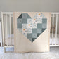Ombre Heart with Sage, backed with Fluffy Sherpa. Hanging over the side of a crib in a nursery.