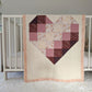 Ombre Heart with Wood Rose, backed with Fluffy Sherpa. Hanging over the side of a crib in a nursery.