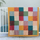 Baby Peipei 's organic patchwork quilt with pastel and earth tones. This quilt is crib sized. With 12 fabrics, this quilt is reminiscent of the Bai Jia Bei Chinese quilt tradition 
