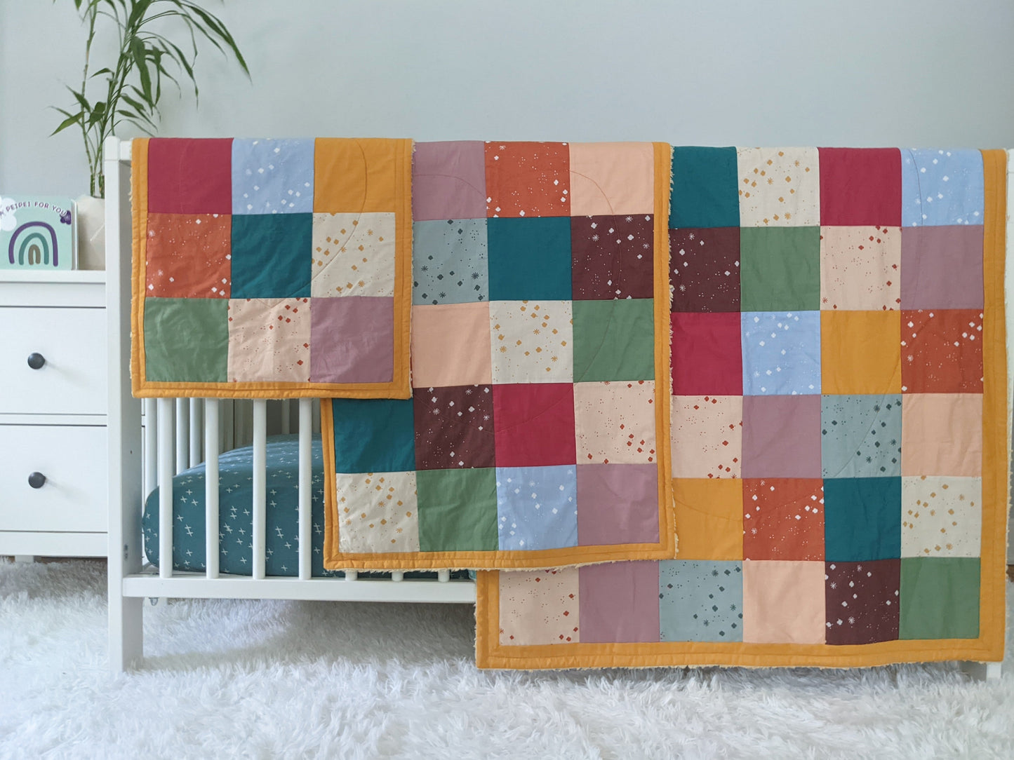 Baby Peipei 's organic patchwork quilts with pastel and earth tones. These patchwork quilt come in three sizes: crib, security blanket, and lovey. With 12 fabrics, these quilts are reminiscent of the Bai Jia Bei Chinese quilt tradition 