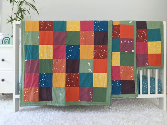 Baby Peipei 's organic patchwork quilts with bright colors. These patchwork quilt come in three sizes: crib, security blanket, and lovey. With 12 fabrics, these quilts are reminiscent of the Bai Jia Bei Chinese quilt tradition 